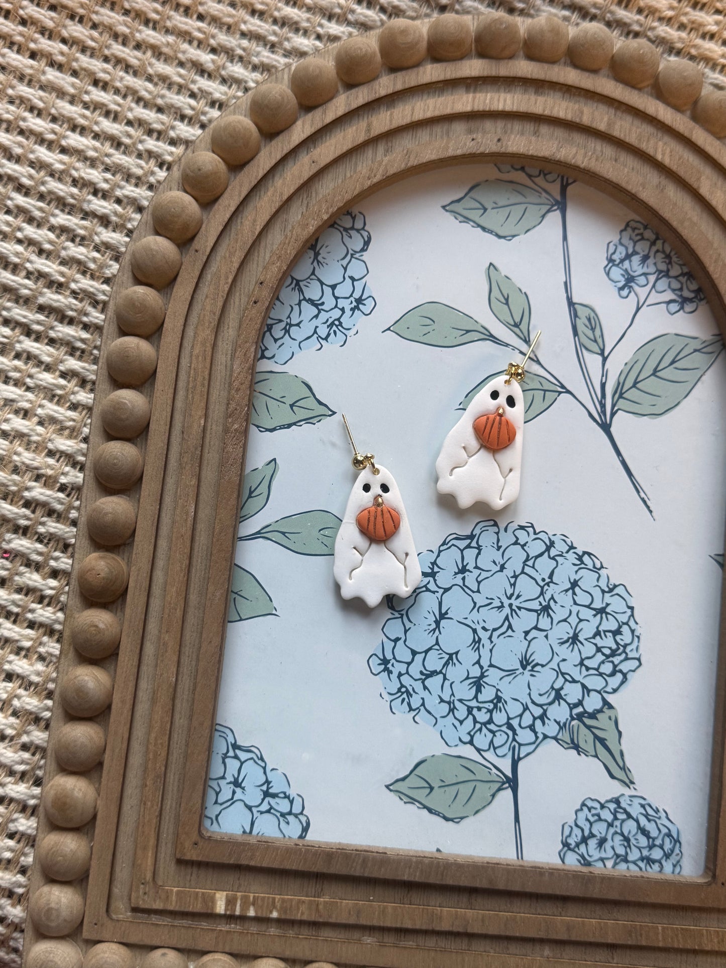 Ghosts holding Pumpkin's Dangles