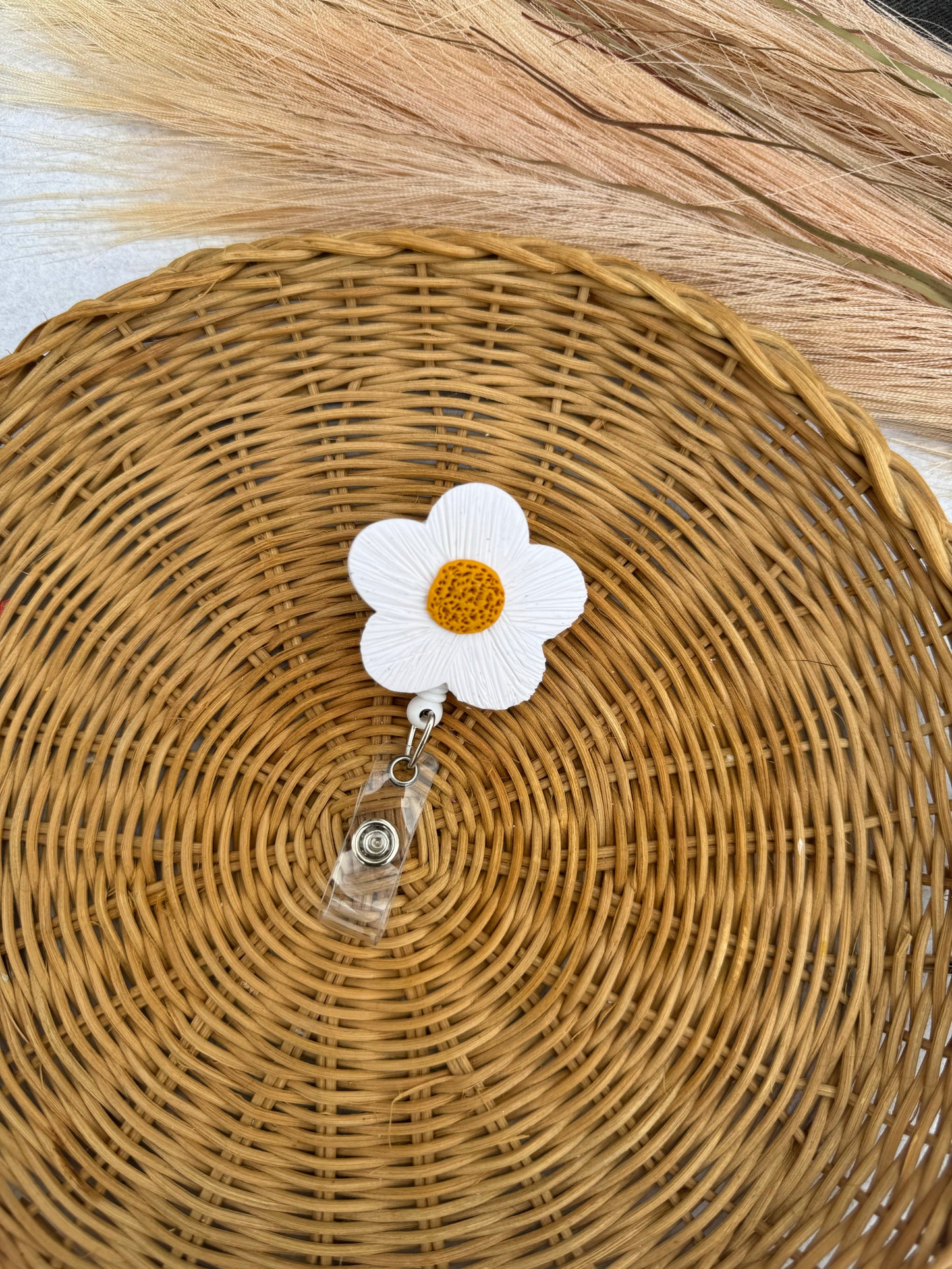 daisy badge reel