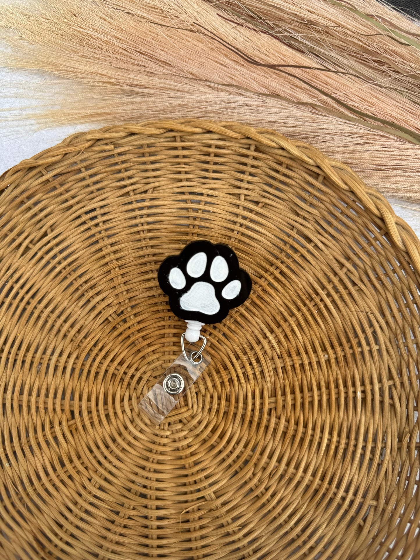 paw print badge reel